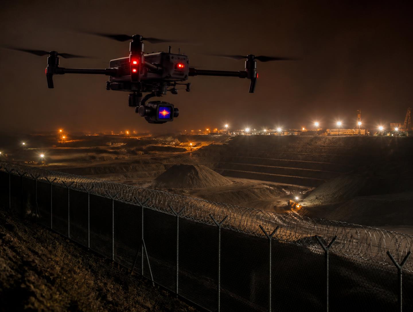 Drone de surveillance nocturne au-dessus d'un site minier
